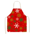 Detail showing red linen apron with festive white snowflakes and green star patterns - Red White Snowflake (WQ01-20)