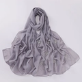 Macro detail of grey chiffon hijab featuring decorative pearls and floral rhinestone patterns - 175x70cm / Light Gray