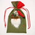 Christmas Santa gift bag made of green burlap fabric with a red drawstring and red berries - Santa Claus