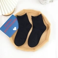 Calze da donna in cotone nero con bordo a balze morbido e trama a maglia fine - Nero Bordo Arrotolato