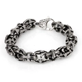 Dettaglio del motivo a croce vintage e della finitura invecchiata sul bracciale - Colore Acciaio (KB40299-D)