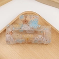 Transparent square hair claw clip with gold and blue snowflake and star patterns - Snowflake & Star