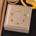 Gold Bracelet with Five Green Rectangular Stones