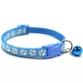 Close-up of light blue pet collar with white paw prints and blue bell for cats - JY Paw Print / Sky Blue