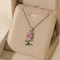 Detail shot of tulip necklace with pink zircon pendant on elegant jewelry gift box - Cable Chain / Silver