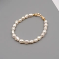 Baroque freshwater pearl bracelet with gold hardware on a minimalist grey background - 5-6mm Baroque Pearl Bracelet