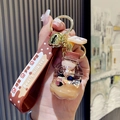 Brown bubble tea keychain with floating bear and liquid quicksand in a mini bottle - Drink Bottle Bear