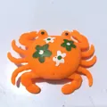 Orange crab bath toy with green floral pattern and squeezy silicone water feature - Floral Print Orange Crab