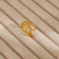 Macro view of vintage gold enamel ring with twisted rope texture and wave design - Gold Wave Spiral Woven Style (107)