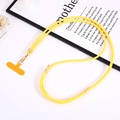 Detail of yellow nylon crossbody phone strap with gold metal clasp and T-shaped insert - Adjustable Nylon Crossbody Chain (K4217) / Yellow