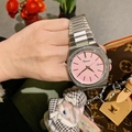 Detailed view of women's silver steel watch featuring a pink dial and date calendar display - Silver Case Pink Dial