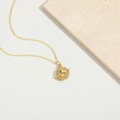 Golden saturn planet pendant necklace with white zircons on minimalist white background - Satellite