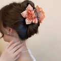 Elegant coral acrylic flower hair clip worn by a model in a traditional Chinese style - 46# Claw Clip - Orange Pink Double Flower Style