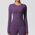 Detail of slim fit long-sleeved purple yoga top and pants set with round neckline - Dark Purple