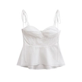Detailed view of white tie-strap tank top with pleated bust and ruffled hemline - XS / White