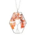 Detail showing handmade tree of life necklace with orange natural stones in hexagonal frame - Red Agate