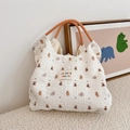 Detail of white seersucker tote bag with bear print and orange braided rope handles - Small Grey Elephant