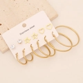Detailed close-up of golden stainless steel earring set with studs and hoops - 2#Star