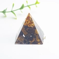 Handcrafted energy pyramid with natural tiger eye crystals and gold foil resin decor - Tiger's Eye