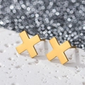 Macro shot of 18K gold plated stainless steel geometric X-shaped earrings on stone - Symbol X / Gold