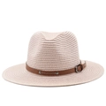 Detailed texture of woven straw sun hat with brown leather band and silver metal studs - Pink