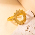 Elegant gold titanium steel ring with textured hollow circular design on a stone base - Gold 62-1