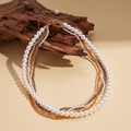Bohemian multi-layer necklace with faux pearls and colorful beads on vintage wood - White