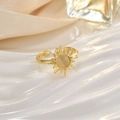 Macro detail of sunburst opal open ring on white waves and champagne silk texture - JZ0101C-Gold White Cat Eye Sunray