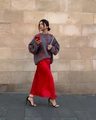Detail of grey knit sweater with red heart patterns paired with red satin skirt - S / Gray