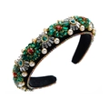 Detailed view of Baroque headband with emerald crystals, red gems, and pearls on velvet - Green