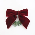 Close-up of a deep red velvet bow with a green pine needle wreath for Christmas decoration - Red Velvet Grass Ring Style (NR251121)