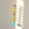 Detail of hanging crystal suncatcher casting vibrant rainbow reflections on the wall - Gold Spiral Royal Blue Crystal Ball