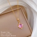 Macro view of gold-plated necklace with pink oval gemstone and technical specifications - Gold Pink Gemstone Style (F552)