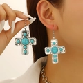 Close-up of vintage silver cross earrings inlaid with turquoise stones on a model - Silver Turquoise Earrings (X312)