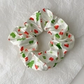 Detailed close-up of white satin Christmas scrunchie with festive gingerbread and tree patterns - Style 11 (White Gingerbread Man)