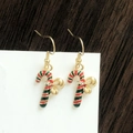 Detail of Christmas candy cane earrings with red and green stripes and gold bow - Christmas Candy Cane with Bow