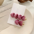Detail of velvet heart hair clips in deep purple with golden metal base on a card - Dust Rose