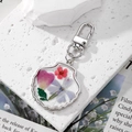Shell shaped keychain with real pressed flowers in resin and silver metal lobster clasp - Shell with Colorful Flowers