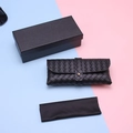 Close-up of black woven leather texture glasses pouch with gift box and microfiber cloth - Black Woven Set with Box