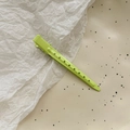 Macro detail of neon green seamless hair clip with hollow circular vents and metal spring - 9cm Positioning Clip / Green