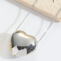 Minimalist silver heart pendant necklace with polished mirror finish on white background - Small Heart / Silver