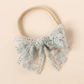 Detail of baby headband with grey lace embroidery and tiered mesh bow design - Grey Blue