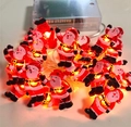 LED Christmas string lights featuring Santa Claus pendant in warm yellow glow - 1m 10-LED (2AA Battery Model) / Waving Santa