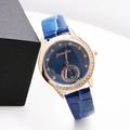 Macro detail of blue leather strap and rose gold rhinestone-studded watch bezel - Blue