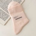 Chaussettes en coton côtelé rose pastel avec un emballage en papier minimaliste - Taille unique / Rose Lait