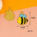 Detail view of 19mm honeybee alloy charm with blue enamel wings and yellow stripes - Small Bee 1