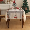 Detail of Christmas table runner with red and green embroidery on beige fabric - Christmas Stocking Embroidery