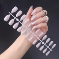 Detail of glossy light purple pointed press-on nails on a plastic display strip - Glossy Light Purple (JJL-23)