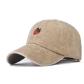 Detail of strawberry embroidery on a washed khaki cotton baseball cap with curved brim - Khaki