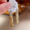 Dettaglio orecchini a foglia dorata con strass di cristallo su etichetta bianca - 7# Nappa con Paillettes e Strass (7# S925 Post-Oro)